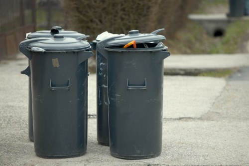 Workers sorting recyclable materials during a home clearance